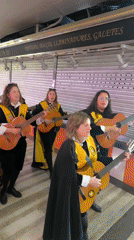 Musical troupe performs in fish market in Ripollet, Spain