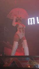 White-costumed performer on stage at MU:IN Bali