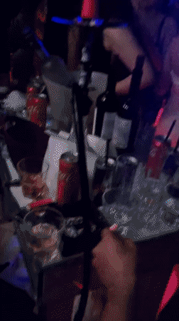 Nightclub patrons dance, smoke hookah in Dobrich Bulgaria venue