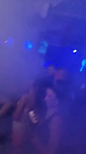 Nightclub patrons dance, smoke hookah in Dobrich Bulgaria venue