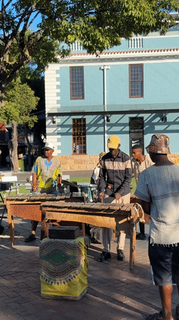 Cape Town waterfront witnesses capture musicians, yachts, Table Mountain views