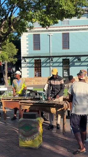 Cape Town waterfront witnesses capture musicians, yachts, Table Mountain views