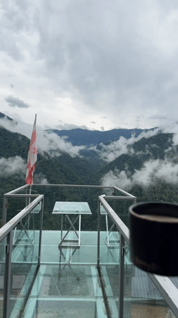 Foggy mountain morning from a glass deck in Silibauri