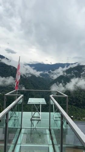 Foggy mountain morning from a glass deck in Silibauri