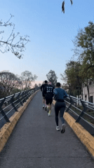 Mexico City witnesses capture runners on overpass, colorful sky