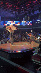 Acrobats and dancers perform on a circular stage in Shanghai