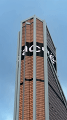 Modern skyscraper with bronze glass facade filmed in Moscow