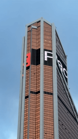 Modern skyscraper with bronze glass facade filmed in Moscow