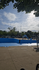 Sunny evening at Laval public pool and playground facilities