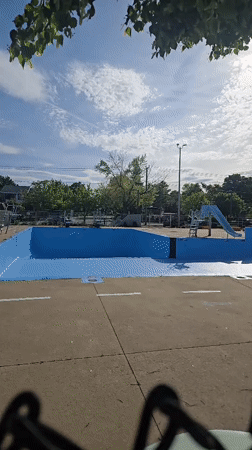 Sunny evening at Laval public pool and playground facilities