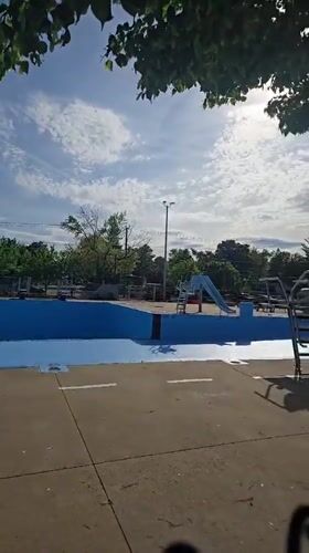 Sunny evening at Laval public pool and playground facilities