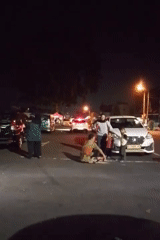 Night gathering in a Boyolali parking lot, kids and crowds