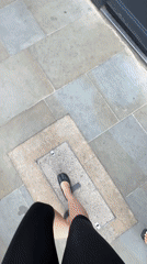 Person records low-angle walking footage on London pavement
