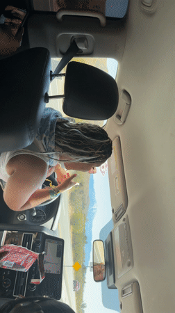 Vehicle travels through sunny Morongo Valley mountains