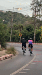 Cycling down a paved road in Ko Samui