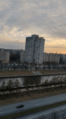 Observer documents sunset cityscape views from Saint Petersburg high-rise
