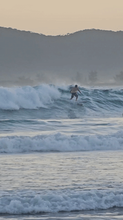 Sunset observed with silhouetted figures at Búzios beach