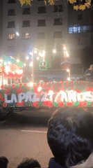 Nighttime parade through La Paz with floats, bands, and dancers
