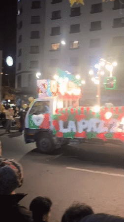 Nighttime parade through La Paz with floats, bands, and dancers