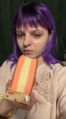 Purple-haired woman eats layered cake in Shchechenki, Russia