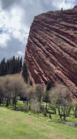 Tourist captures red rock formations at Jeti-Ögüz, Kyrgyzstan
