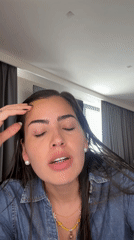 Woman films makeup tutorial at home in Mexico