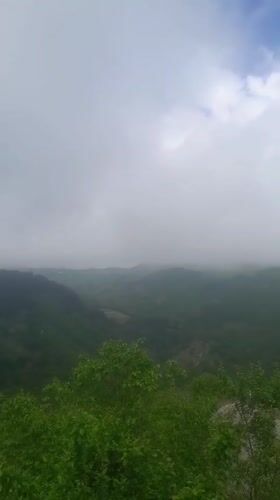 Serene green hills recorded under cloudy Armenian morning sky