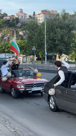 Festive car parade with Bulgarian flags celebrates in Plovdiv