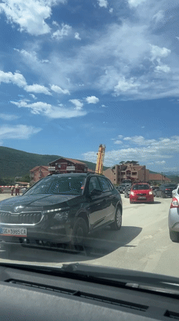 Construction traffic filmed on unpaved road in Montenegro