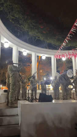 Military band performs a nighttime concert in Barranco's gazebo
