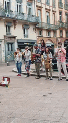 Street band performs at Goudouli fountain in Toulouse