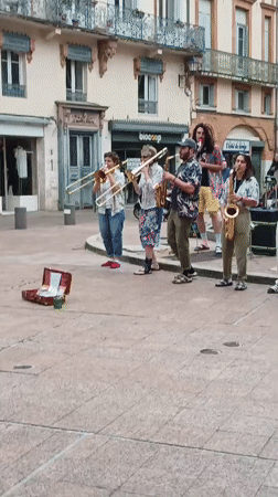 Street band performs at Goudouli fountain in Toulouse