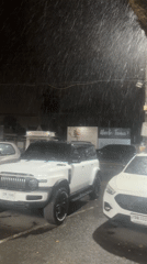 Rainy street scene and musical performance documented in Thailand