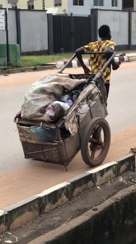 Street life and stray animals in a Lagos neighborhood