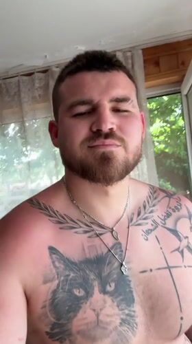 Man takes shirtless selfie indoors in Sliven, Bulgaria