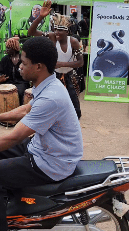 Traditional dance, drumming, and street life at a community gathering