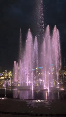 Colorful illuminated fountain display draws evening crowds in Perm