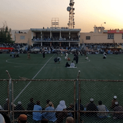 Large crowd gathers at Kandahar stadium during afternoon event
