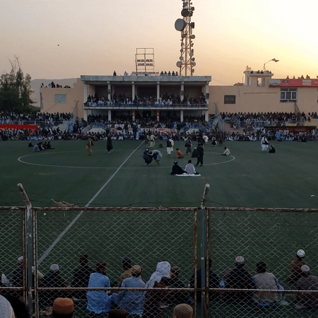 Large crowd gathers at Kandahar stadium during afternoon event