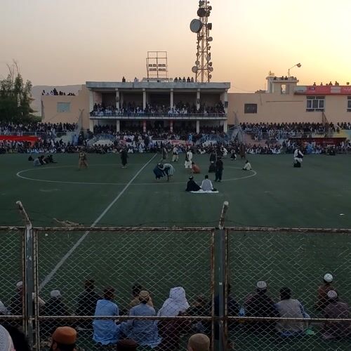 Large crowd gathers at Kandahar stadium during afternoon event