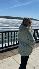 Spring outing captured along frozen waterfront in Chaikovsky, Russia