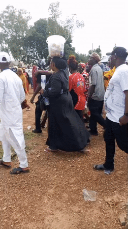 Women gather outside Hall 5 in Akwanga, Nigeria