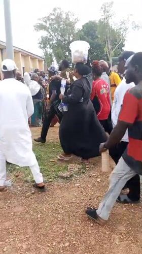 Women gather outside Hall 5 in Akwanga, Nigeria