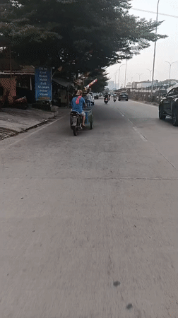 Morning traffic and electric buses on Jakarta's streets