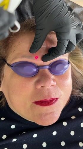 Woman gets eyebrow treatment at Riga beauty salon