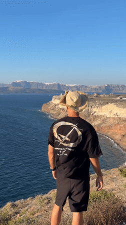 Cliffside afternoon on Santorini's rocky Aegean coastline