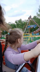 Mother and daughter enjoy amusement park rides in Yekaterinburg