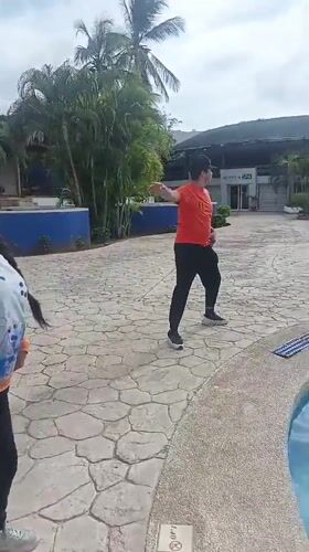 Resort guests participate in poolside fitness routine in Venezuela