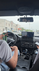 Two men travel by car in Parakar, Armenia