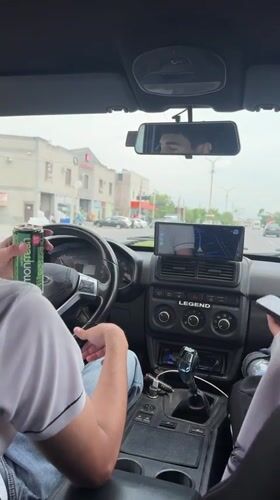 Two men travel by car in Parakar, Armenia